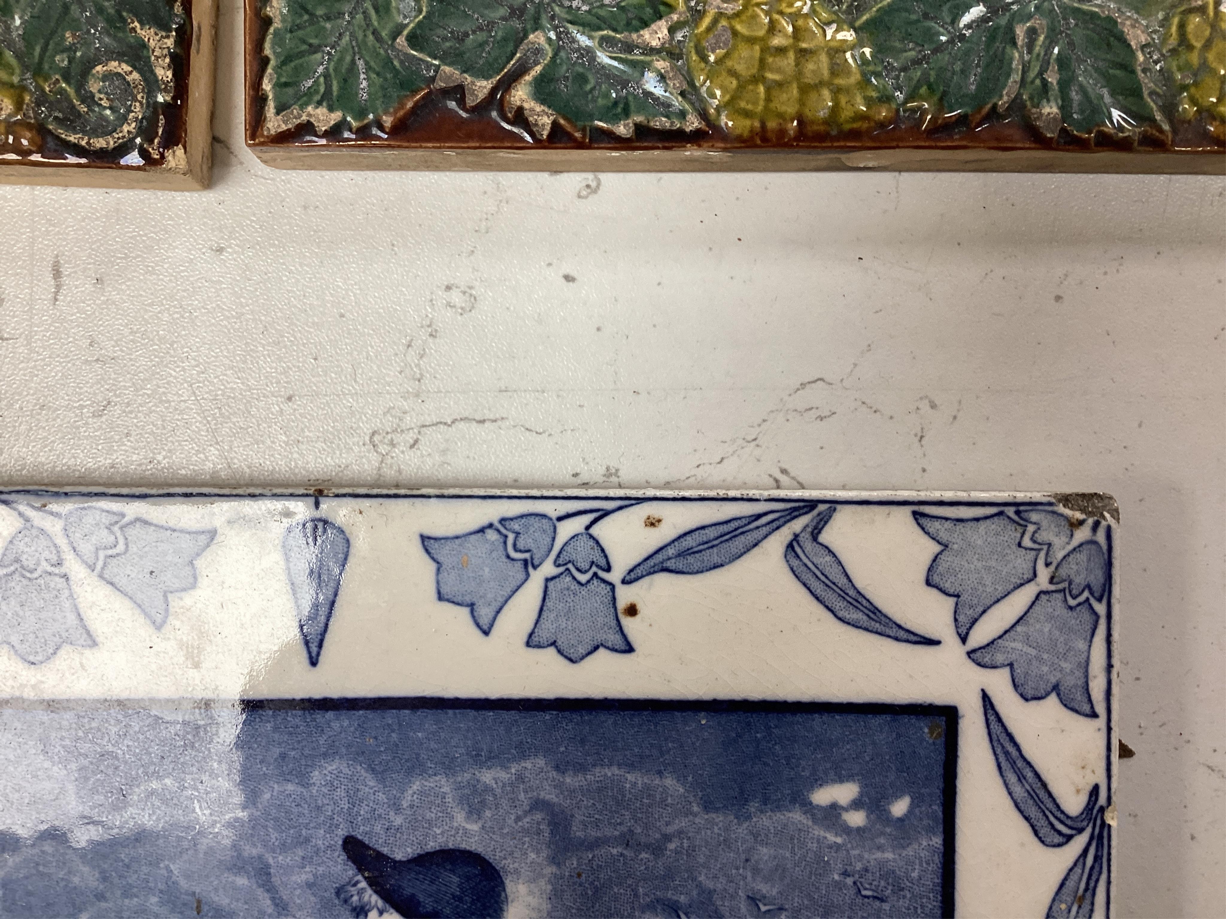 A Victorian five tile framed panel, a Wedgwood November tile and two majolica tiles, five tile panel 80cm high. Condition - worn and crazed